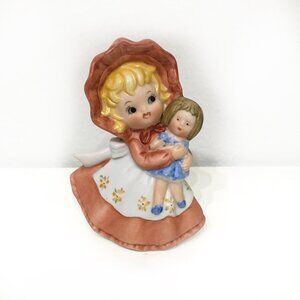 Ceramic Girl Holding Doll Figurine